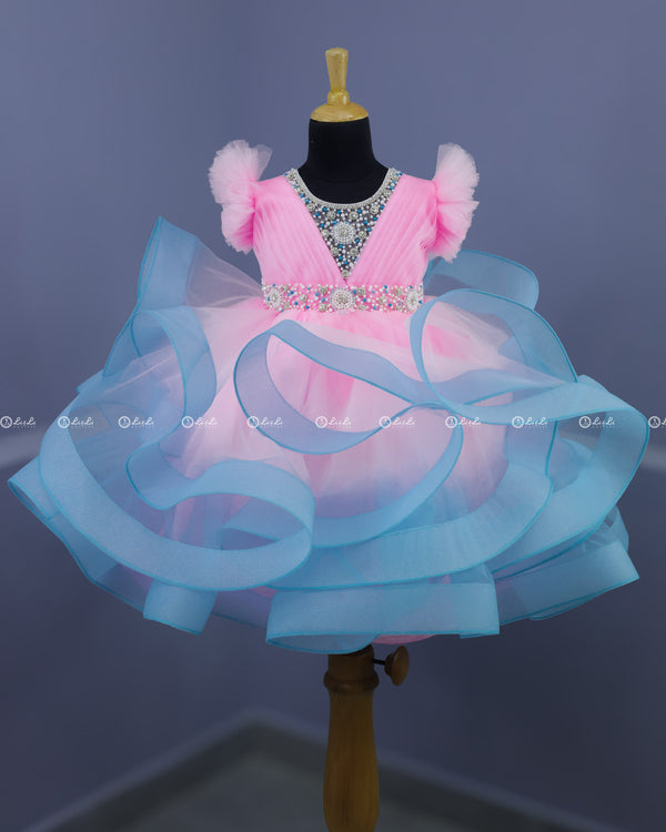 Baby Pink and Sky Blue Twirled Gown with Rich White Bead Work.