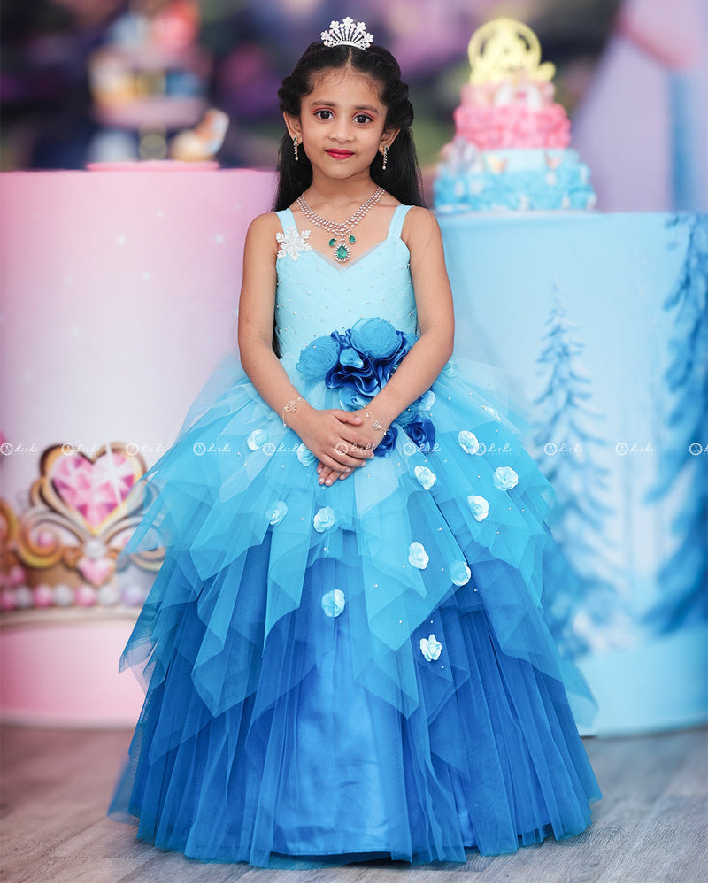 Baby Blue with Sea Blue Color Gradient Asymmetrical Layered Gown with Rose Applique.