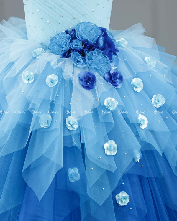Baby Blue with Sea Blue Color Gradient Asymmetrical Layered Gown with Rose Applique.