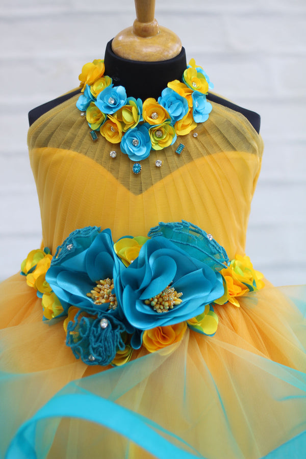 Yellow And Sea Blue Color Combo Halter Neck Twirled Couture Gown With Yellow And Sea Blue Flower Embellishments
