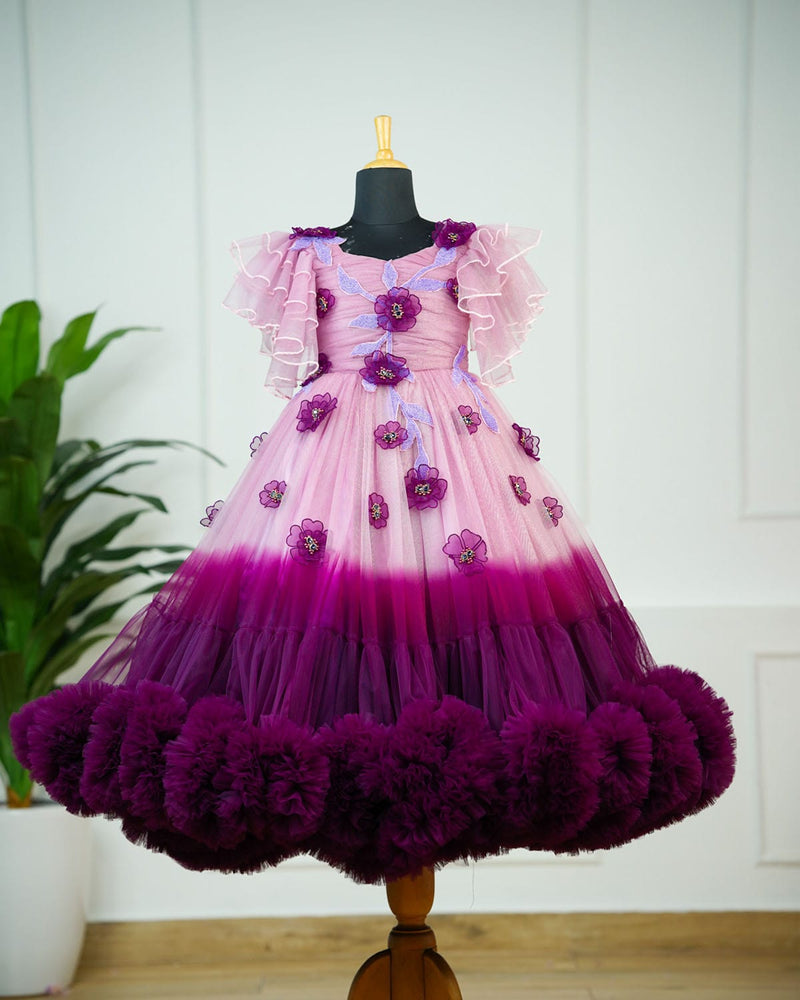 Plum purple and onion pink colour gradient heavy frill gown with hand crafted embellishments and layered sleeves