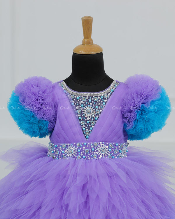 Lavender & Sky Blue  Feather Frilled Gown With Rich Golden Bead Work Gown