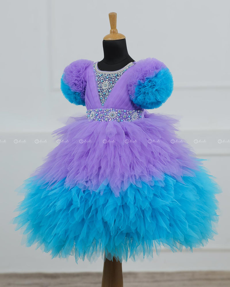 Lavender & Sky Blue  Feather Frilled Gown With Rich Golden Bead Work Gown