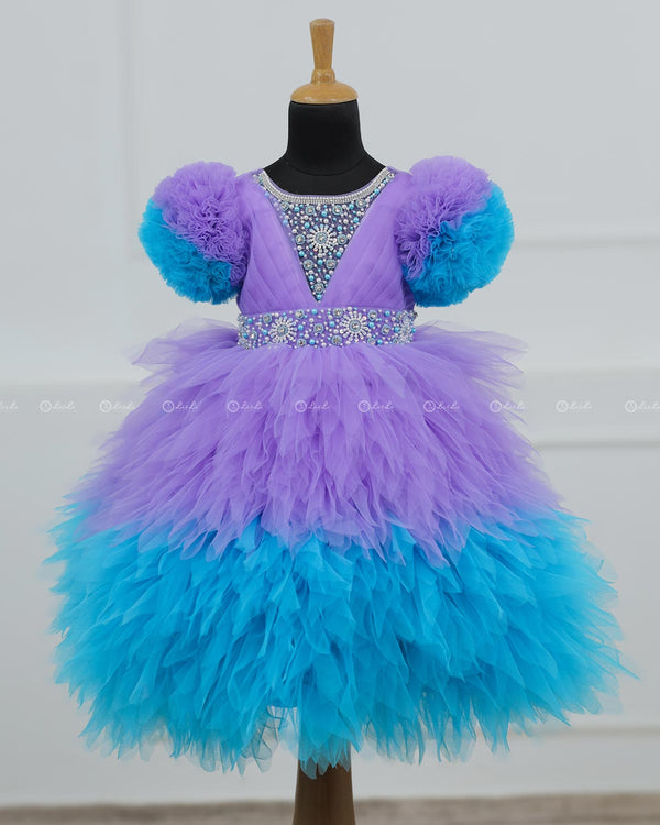 Lavender & Sky Blue  Feather Frilled Gown With Rich Golden Bead Work Gown