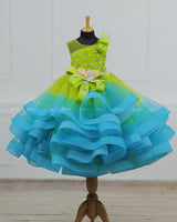 Lime Green & Turquoise Blue Twirled Gown with Multicolored Pastel Flower Embellished Yoke & Hcrafted Bow