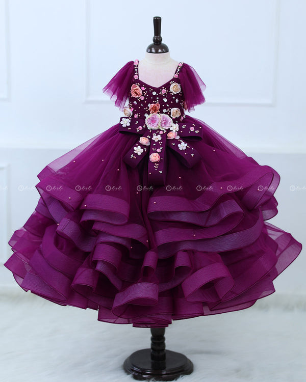 Plum Purple  twirled gown with multicolored pastel flower embellished yoke and hand crafted bow