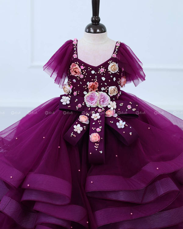 Plum Purple  twirled gown with multicolored pastel flower embellished yoke and hand crafted bow