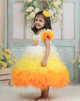 White Bodice Dress With Chick Print And Layered Yellow-Orange Feathered Gown