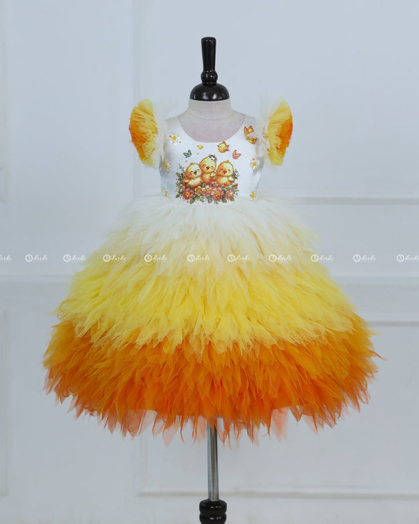 White Bodice Dress With Chick Print And Layered Yellow-Orange Feathered Skirt