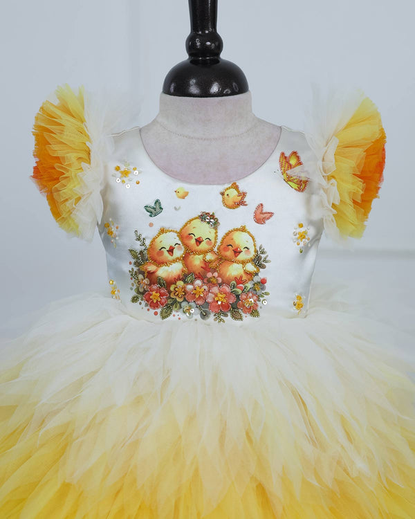 White Bodice Dress With Chick Print And Layered Yellow-Orange Feathered Skirt