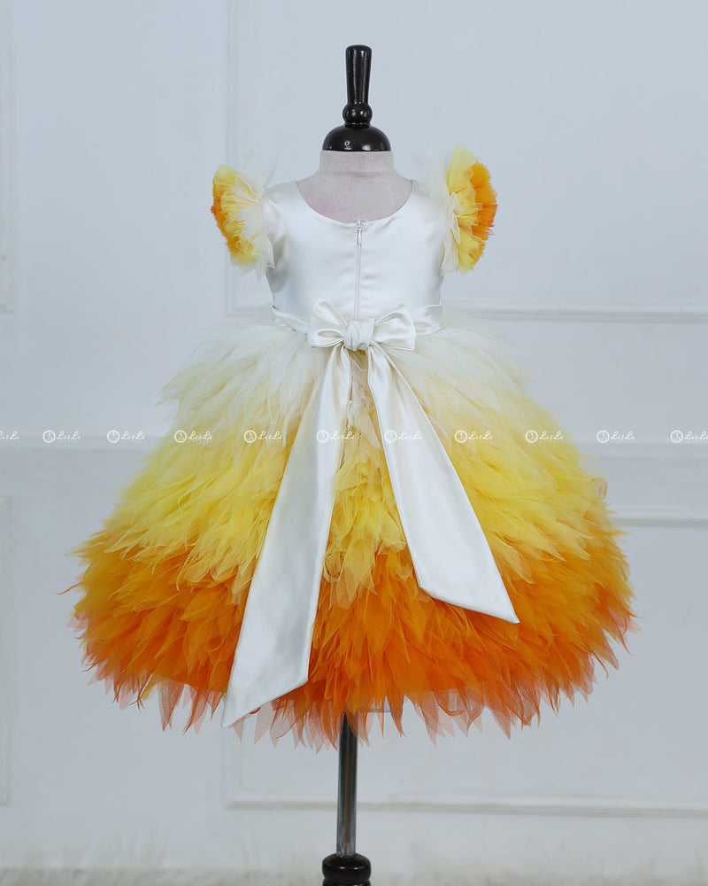 White Bodice Dress With Chick Print And Layered Yellow-Orange Feathered Skirt