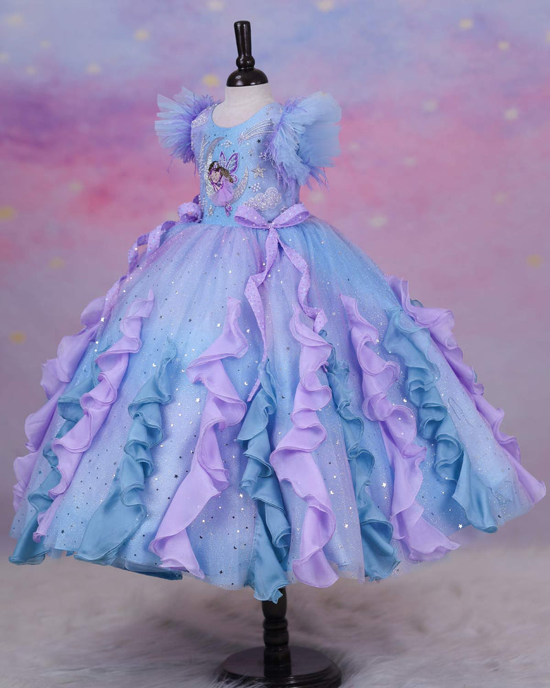 A dreamy lilac-blue fairy gown with butterfly details, side bows, and sparkling ruffles.
