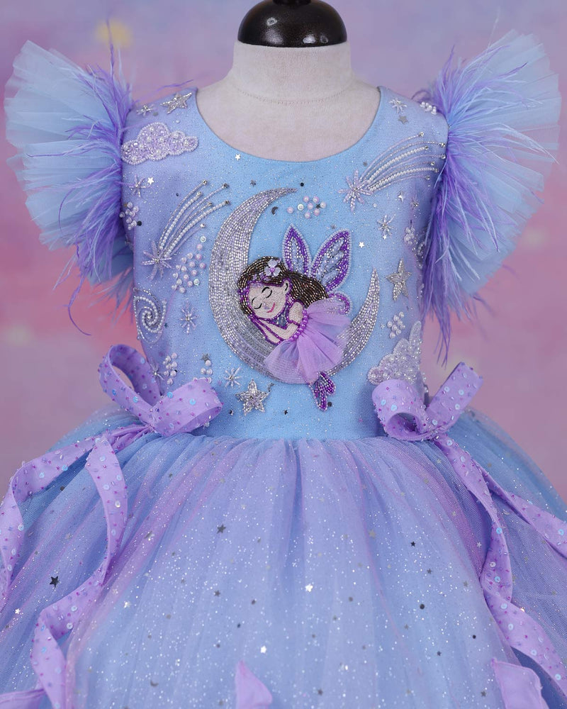 A dreamy lilac-blue fairy gown with butterfly details, side bows, and sparkling ruffles.