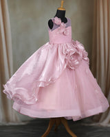 Pastel-pink gown with 3D flowers and soft tulle layers.