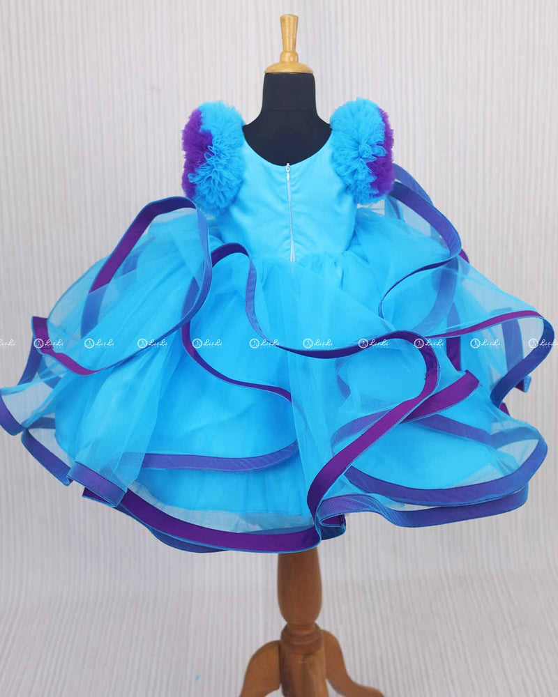 Moonlight- Sky blue Twirled Party wear Gown with purple and Royal blue Flower