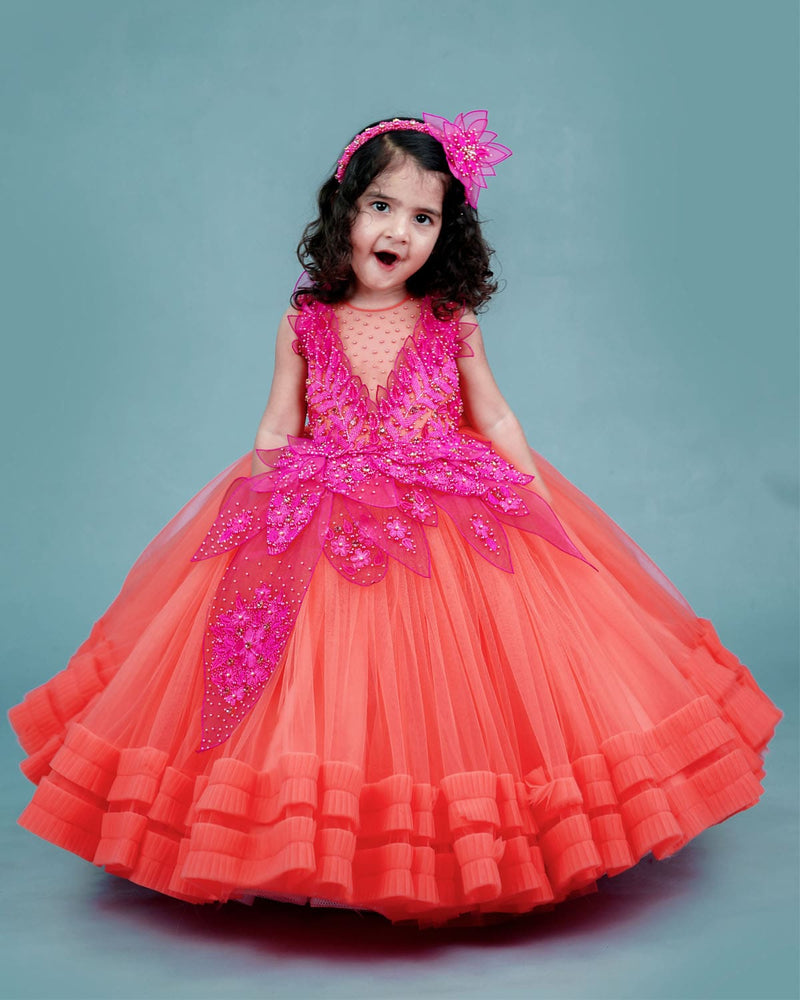 coral and fuchsia pink  party wear gown with heavy and crafted yoke and petal detailing