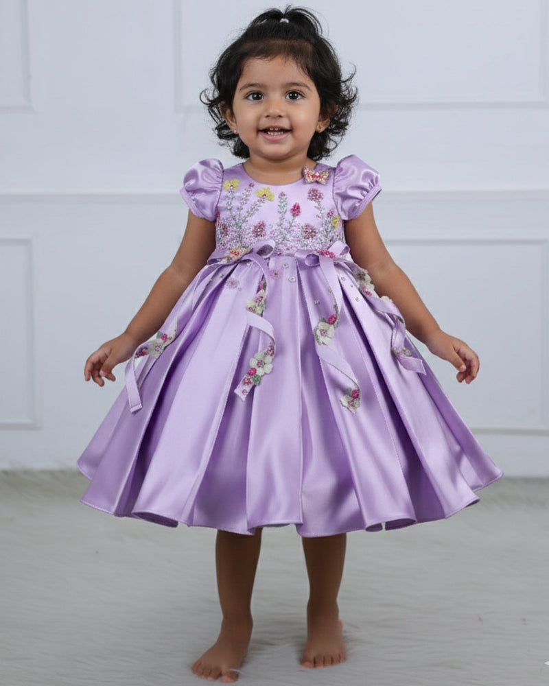 Butterfly and Floral Theme Lavender Frock with Attached Bows in waistline and Applique Works.