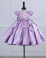 Butterfly and Floral Theme Lavender Frock with Attached Bows in waistline and Applique Works.