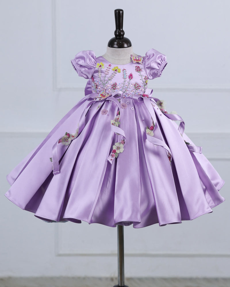 Butterfly and Floral Theme Lavender Frock with Attached Bows in waistline and Applique Works.