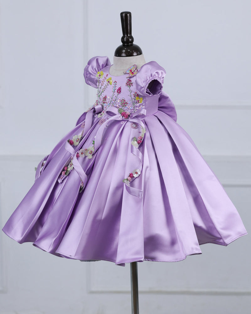 Butterfly and Floral Theme Lavender Frock with Attached Bows in waistline and Applique Works.