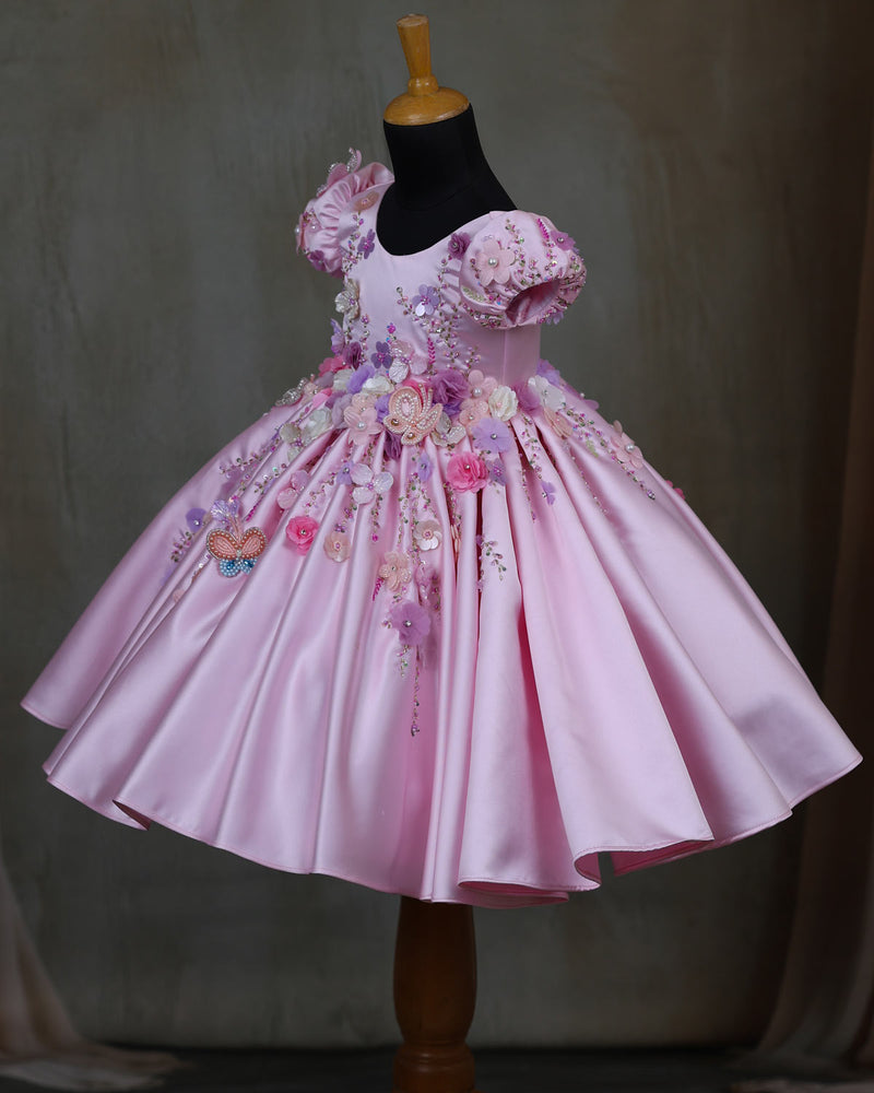 Elegant pink floral frock with puff sleeves and handworked butterfly