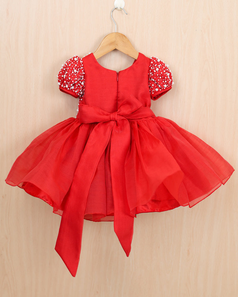 Red organza frock with white pearl embellishment