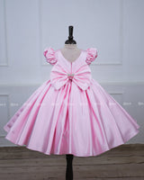 Baby pink floral frock with puff sleeves and handworked butterfly with bow