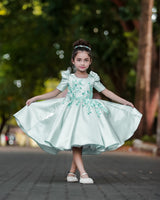 Pastel Aqua Blue Elegant Dress Highlighted With Handcrafted Flowers.