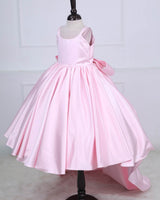Princess-style pink gown with a flowing trail and large back bow.