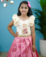 Pink brocade skirt with creme ruffled handcrafted top pattupavada set