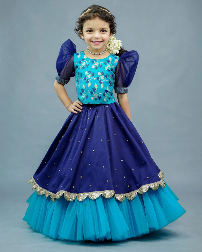 Girls aqua blue brocade top with puff sleeves and navy blue frilled net skirt