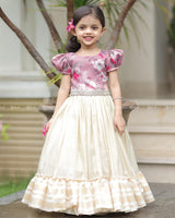 Mauve Floral Puff-Sleeve Top With Lace Hem, Paired With Cream Flared Skirt Featuring Golden Stripes And Ruffle Border