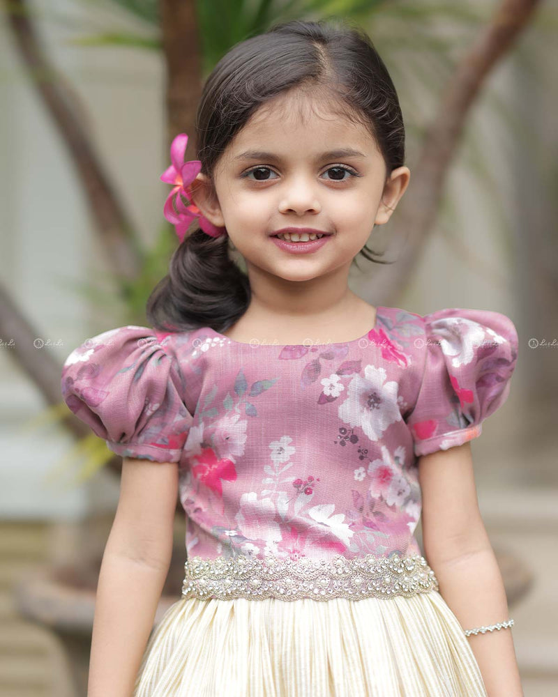 Mauve Floral Puff-Sleeve Top With Lace Hem, Paired With Cream Flared Skirt Featuring Golden Stripes And Ruffle Border