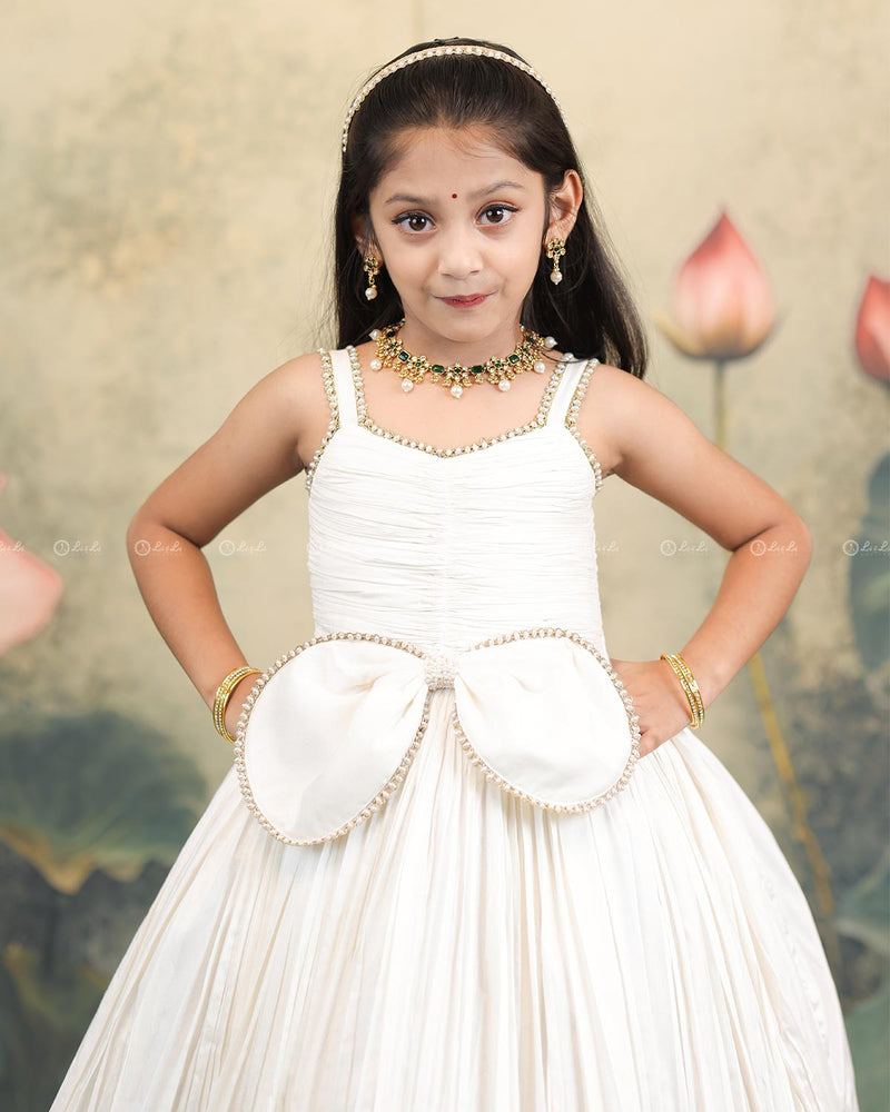 Ivory Frock With Pearl Neckline, Ruched Yoke, Waist Bow And Floral Woven Border