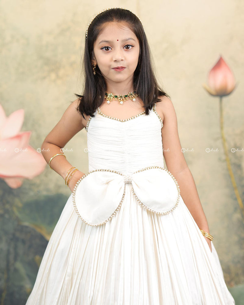 Ivory Frock With Pearl Neckline, Ruched Yoke, Waist Bow And Floral Woven Border