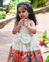 Ivory Frock With Pearl Neckline, Ruched Yoke, Waist Bow And Floral Woven Border