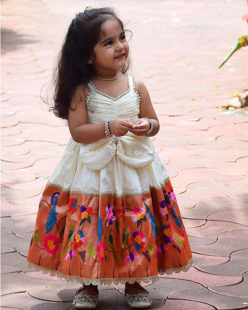 Ivory Frock With Pearl Neckline, Ruched Yoke, Waist Bow And Floral Woven Border