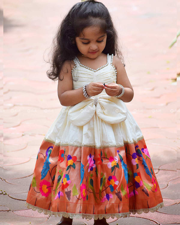 Ivory Frock With Pearl Neckline, Ruched Yoke, Waist Bow And Floral Woven Border