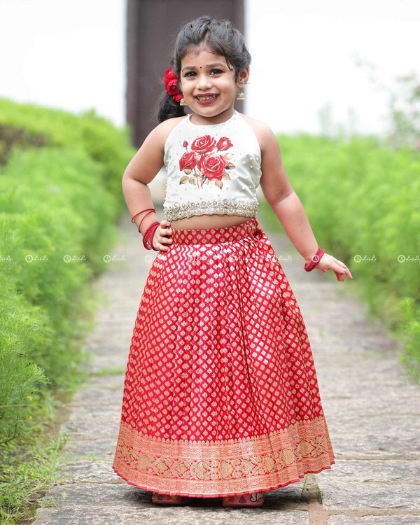 Floral Halter Top With Pearl Detailing, Paired With Red Brocade Skirt