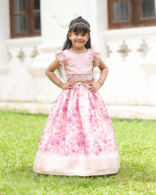 Pink Lace Top With Flutter Sleeves Paired With A Floral Umbrella Skirt