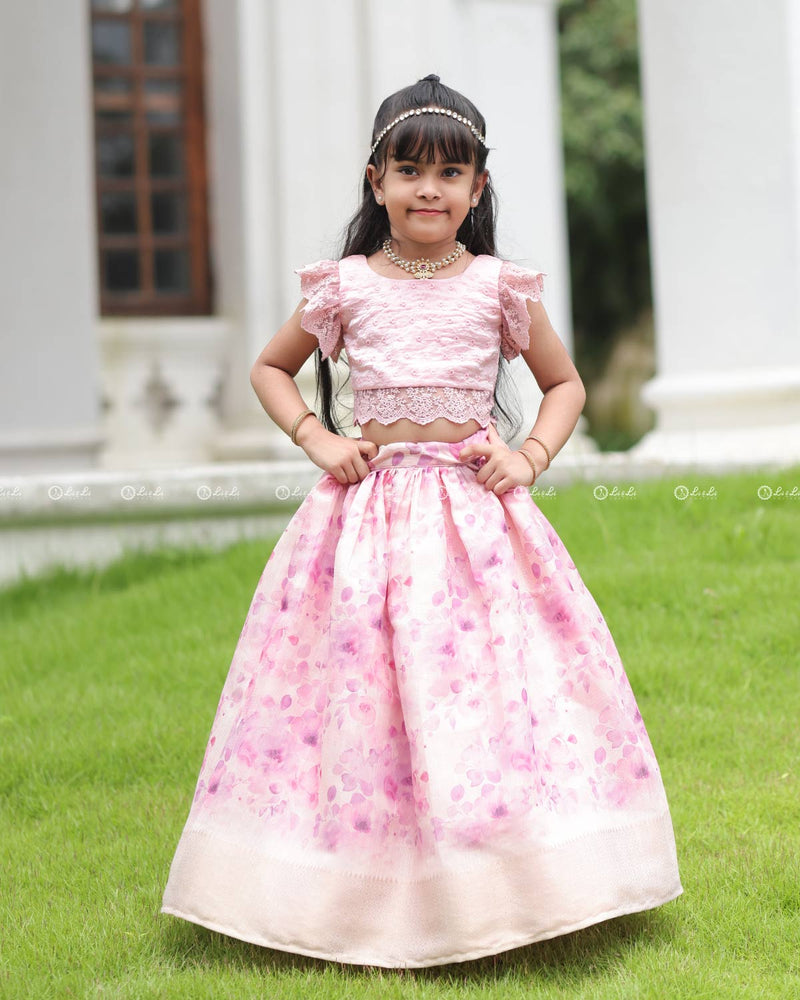 Pink Lace Top With Flutter Sleeves Paired With A Floral Umbrella Skirt