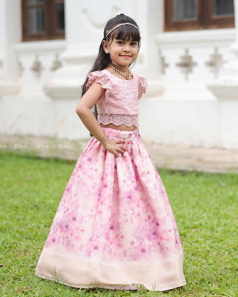 Pink Lace Top With Flutter Sleeves Paired With A Floral Umbrella Skirt