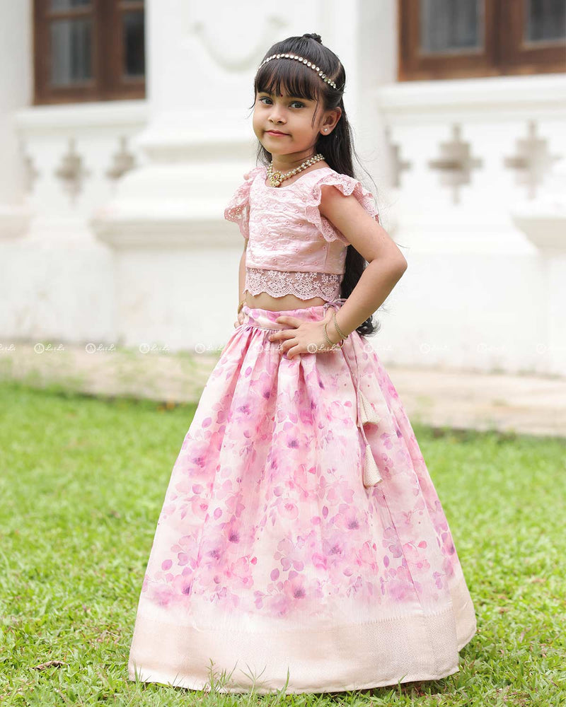 Pink Lace Top With Flutter Sleeves Paired With A Floral Umbrella Skirt