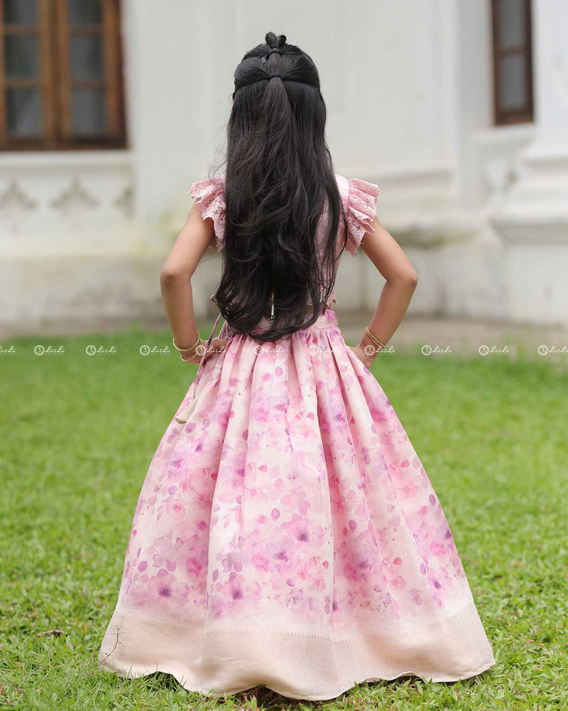 Pink Lace Top With Flutter Sleeves Paired With A Floral Umbrella Skirt