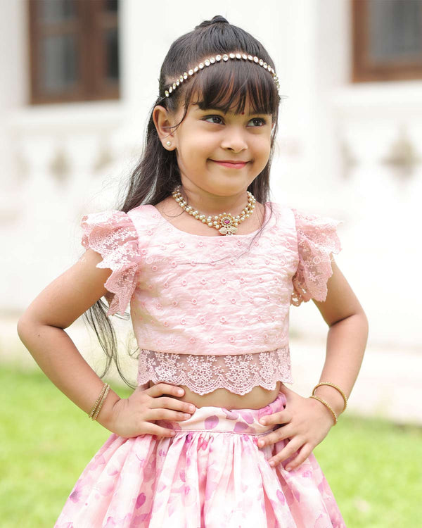 Pink Lace Top With Flutter Sleeves Paired With A Floral Umbrella Skirt