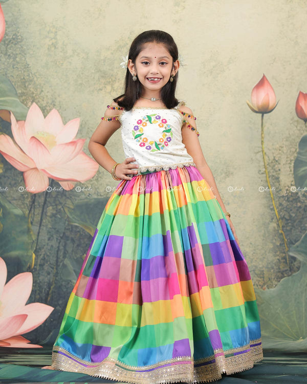 Pearl white top with beaded tassel sleeves and multi-color checked skirt for girls