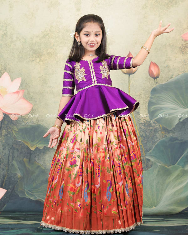 Purple Peplum Top Paired With A Printed Skirt