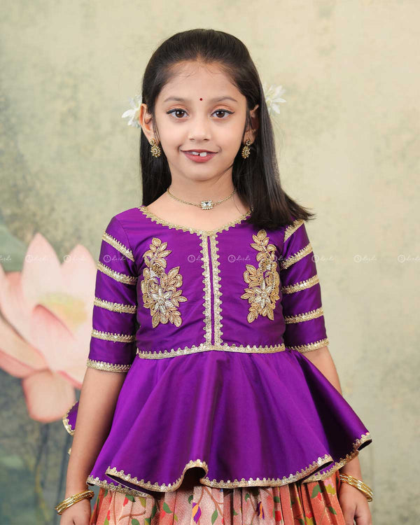 Purple Peplum Top Paired With A Printed Skirt
