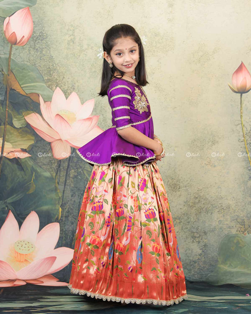 Purple Peplum Top Paired With A Printed Skirt