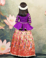 Purple Peplum Top Paired With A Printed Skirt